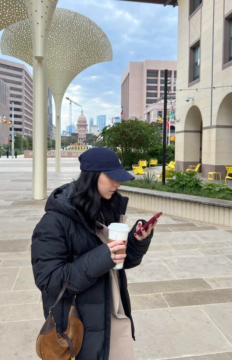 Women wearing ralph lauren polo accessories like a had and purse.
