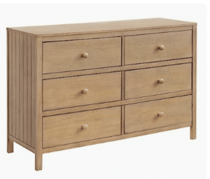 Screenshot 2026-02-06 at 10.40.56 PM Warm wood six-drawer dresser with simple hardware in a modern nursery