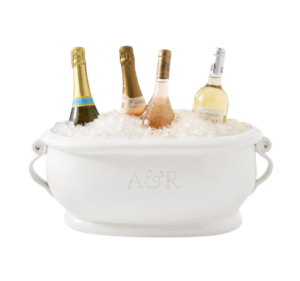 Get festive and start celebrating with your favorite drinks in this elegant, Italian-crafted beverage bucket. Perfect for keeping bottles and cans cold, it features handmade ceramic accents, decorative side handles, and a shiny finish.